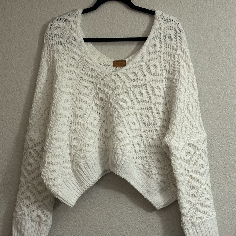 White off-the-shoulder or vneck sweater